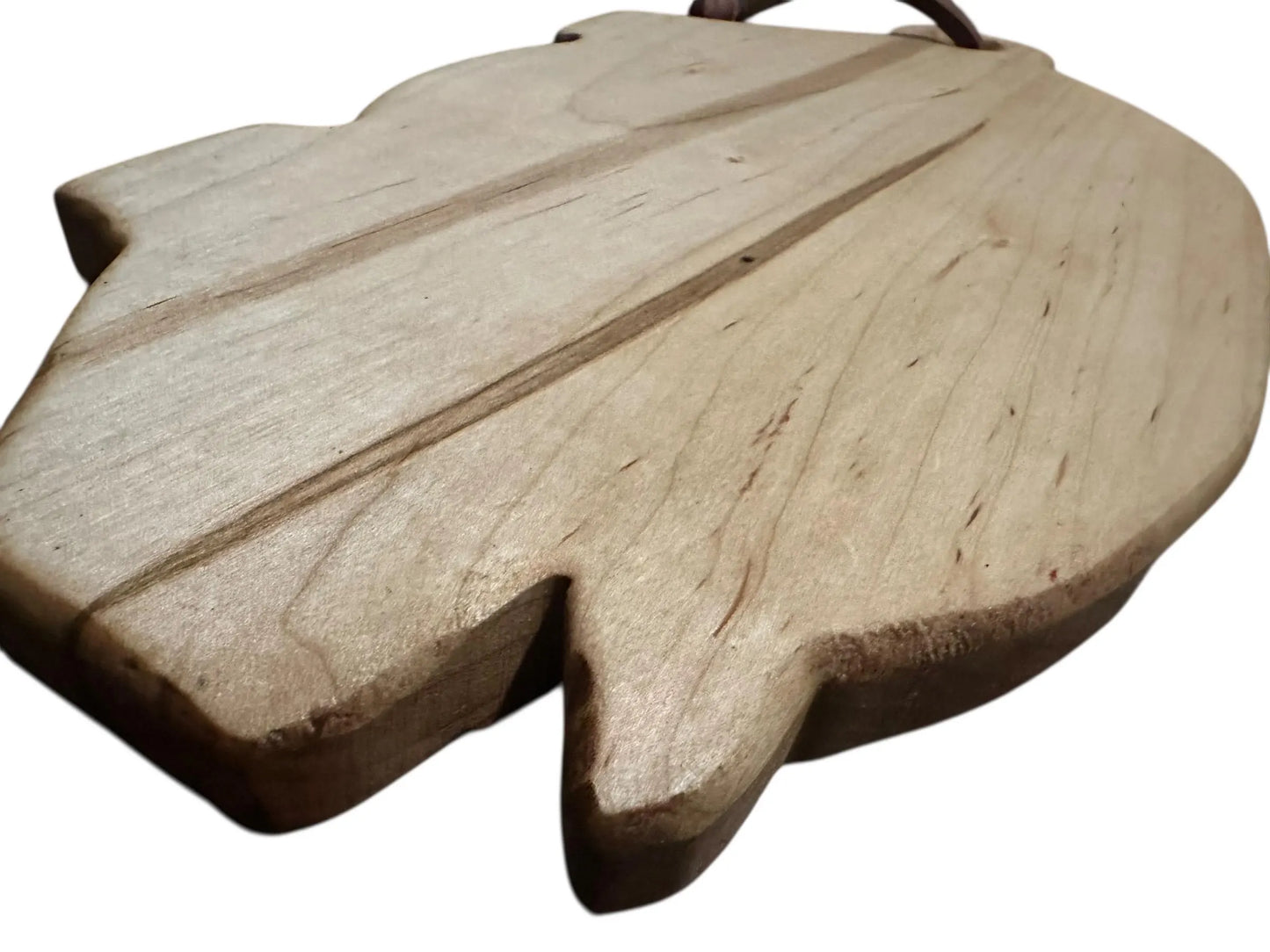 Wooden leaf-shaped object on a white background