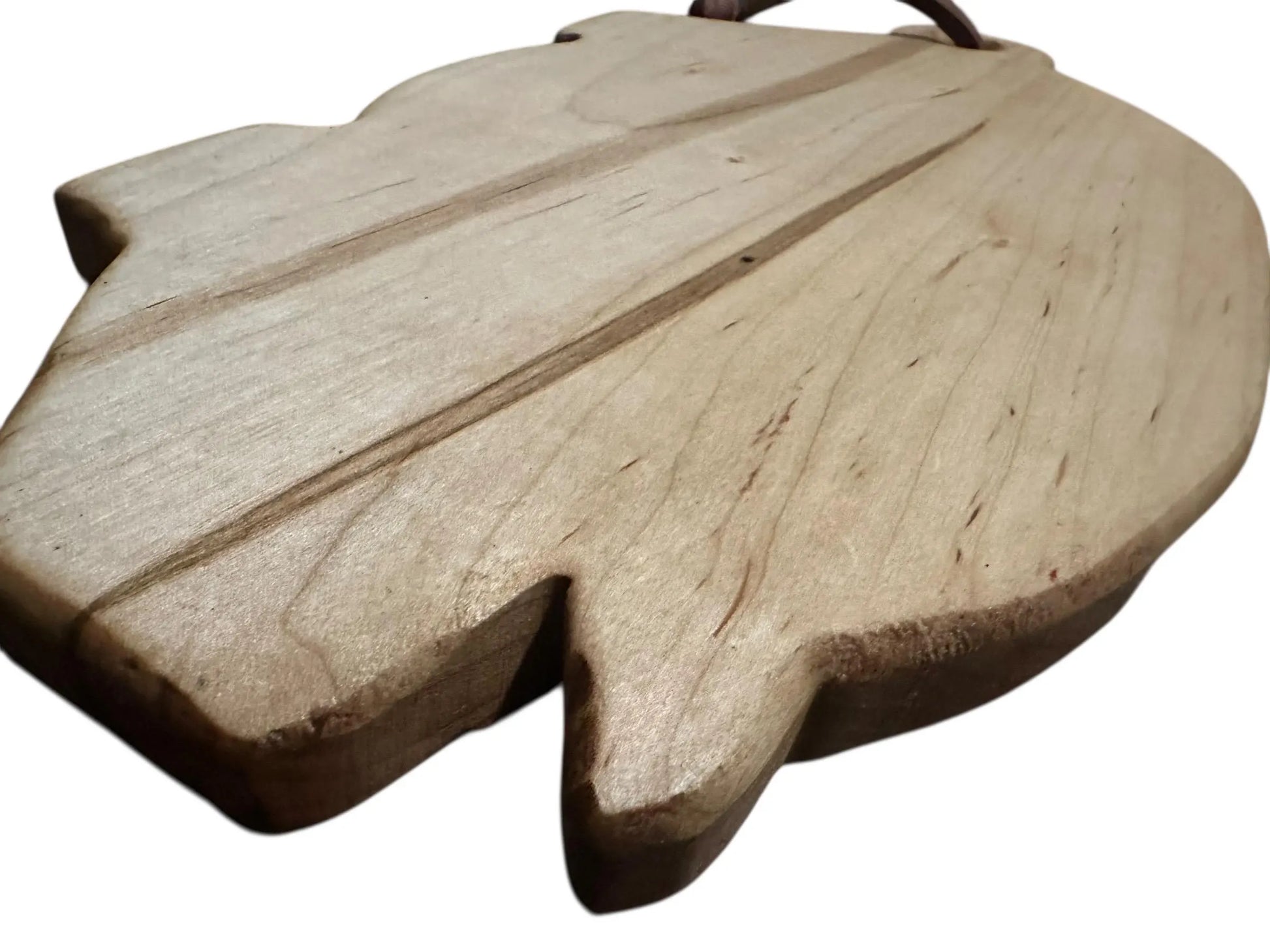 Wooden leaf-shaped object on a white background