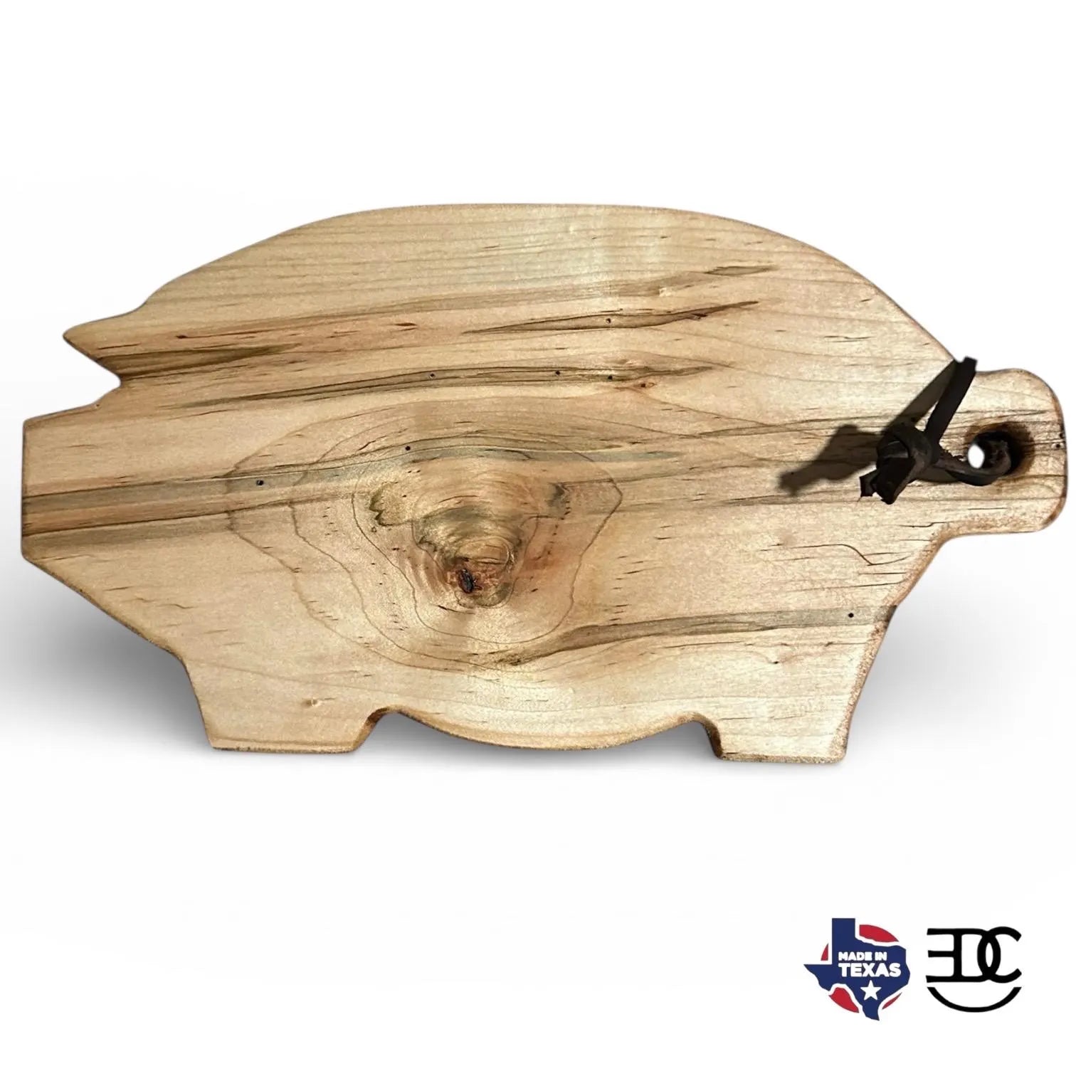 Wooden cutting board shaped like a pig with a Texas flag logo in the corner
