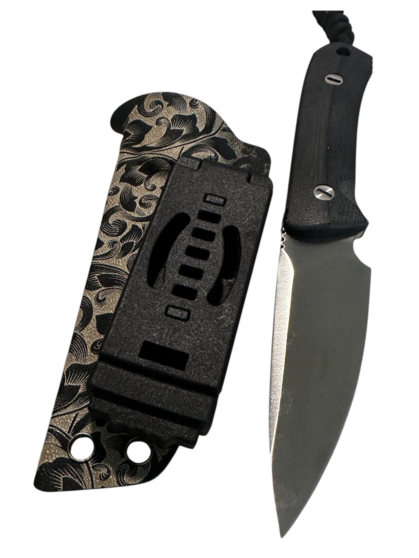 Compact 7-inch D2 fixed blade featuring black Micarta scales, custom floral engraved Kydex sheath, black paracord lanyard, and complimentary RockinEDC Steel Wax.