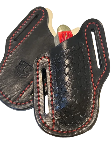 Black leather holster with red stitching on a beige background